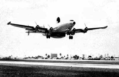 A crewmember loads up his baggage