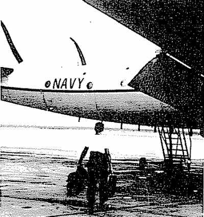 A crewmember loads up his baggage