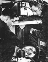 Observers prepare dropsonde for storm eye