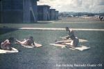 Sun Bathing at the rear of VW-1 Barracks NAS Agana Guam 58