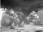 VW-1 crewmen taking a break between flights while tracking Typoon Gloria in 1957. 
