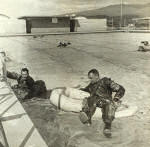 VW-1 aircrewmen testing exposure suits, Jan 1953, in the NAS Barbers Point pool