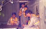 Buster Tipton AG3, Vic Callison AT2 and another CIC operator at aft chow table waiting for command from the flight station to prepare for take off