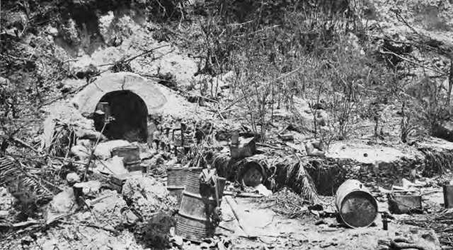  Marine holds up canvas cover of ammunition rack